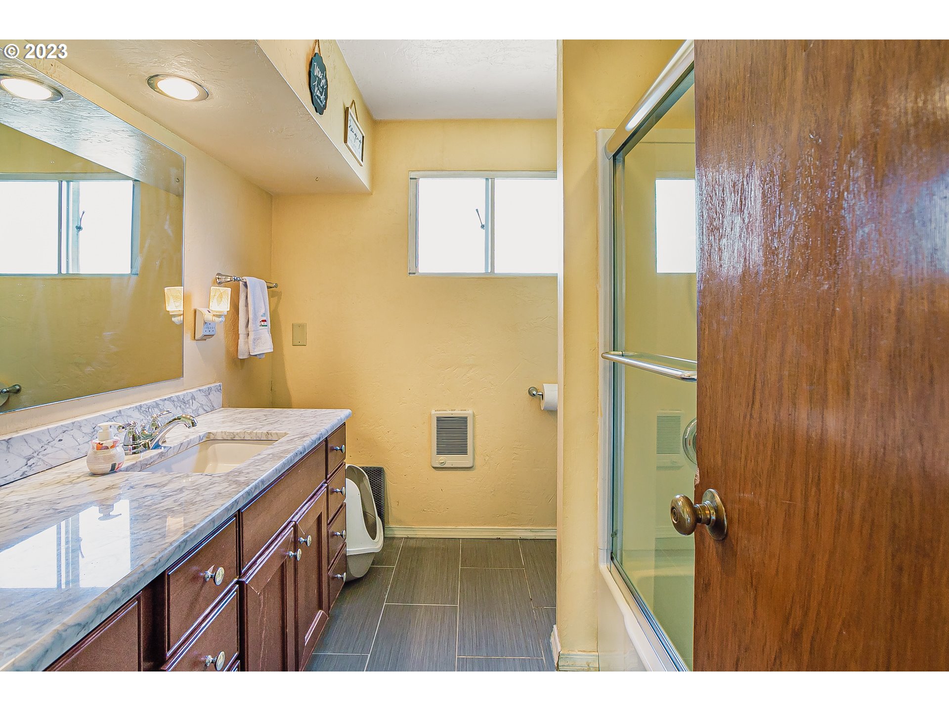 465 North 24th Street Springfield, OR 97477 - Photo 16 of 30 a bathroom with a sink and a mirror