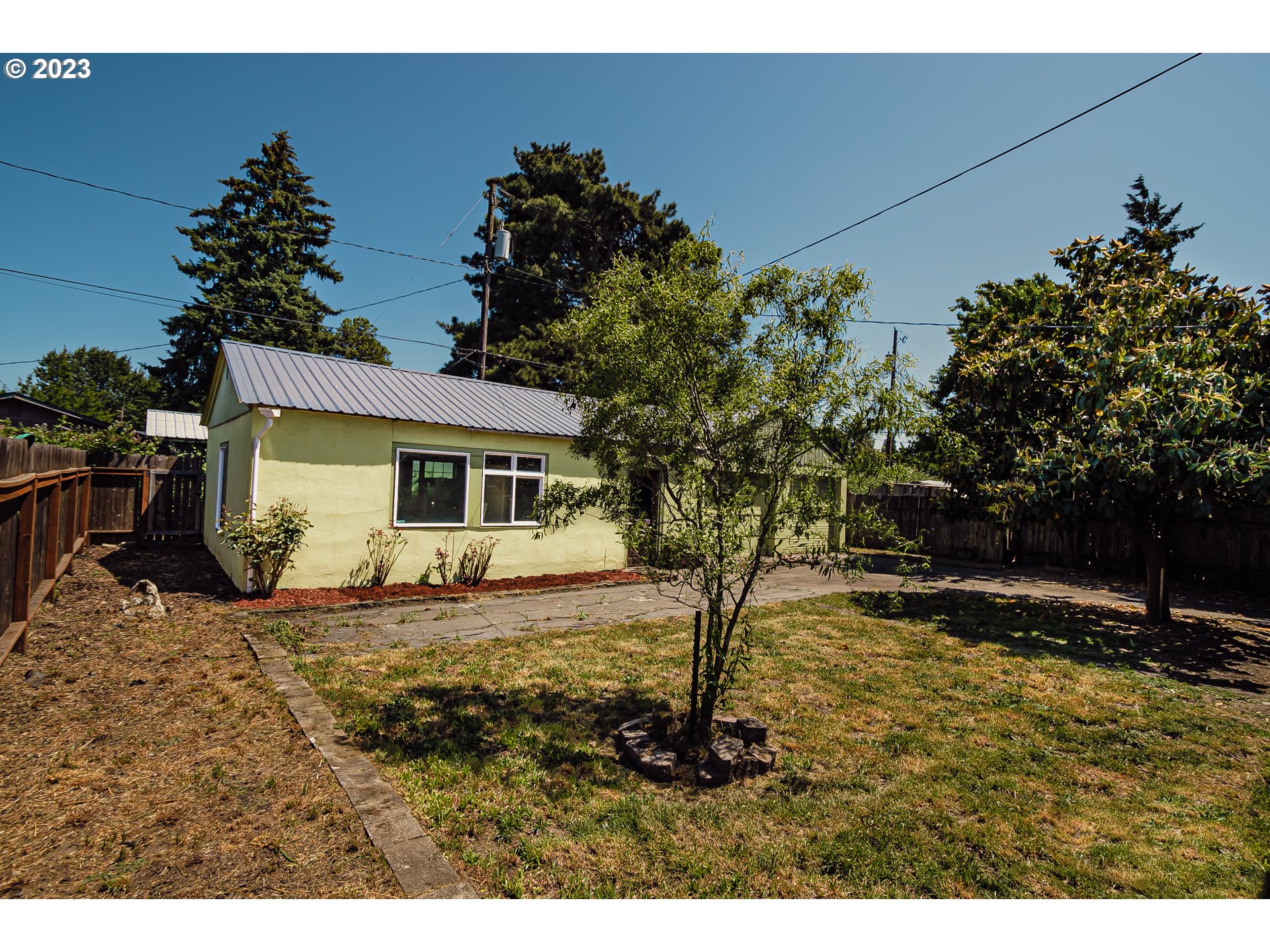465 North 24th Street Springfield, OR 97477 - Photo 21 of 30 a view of a house with a tree in the background