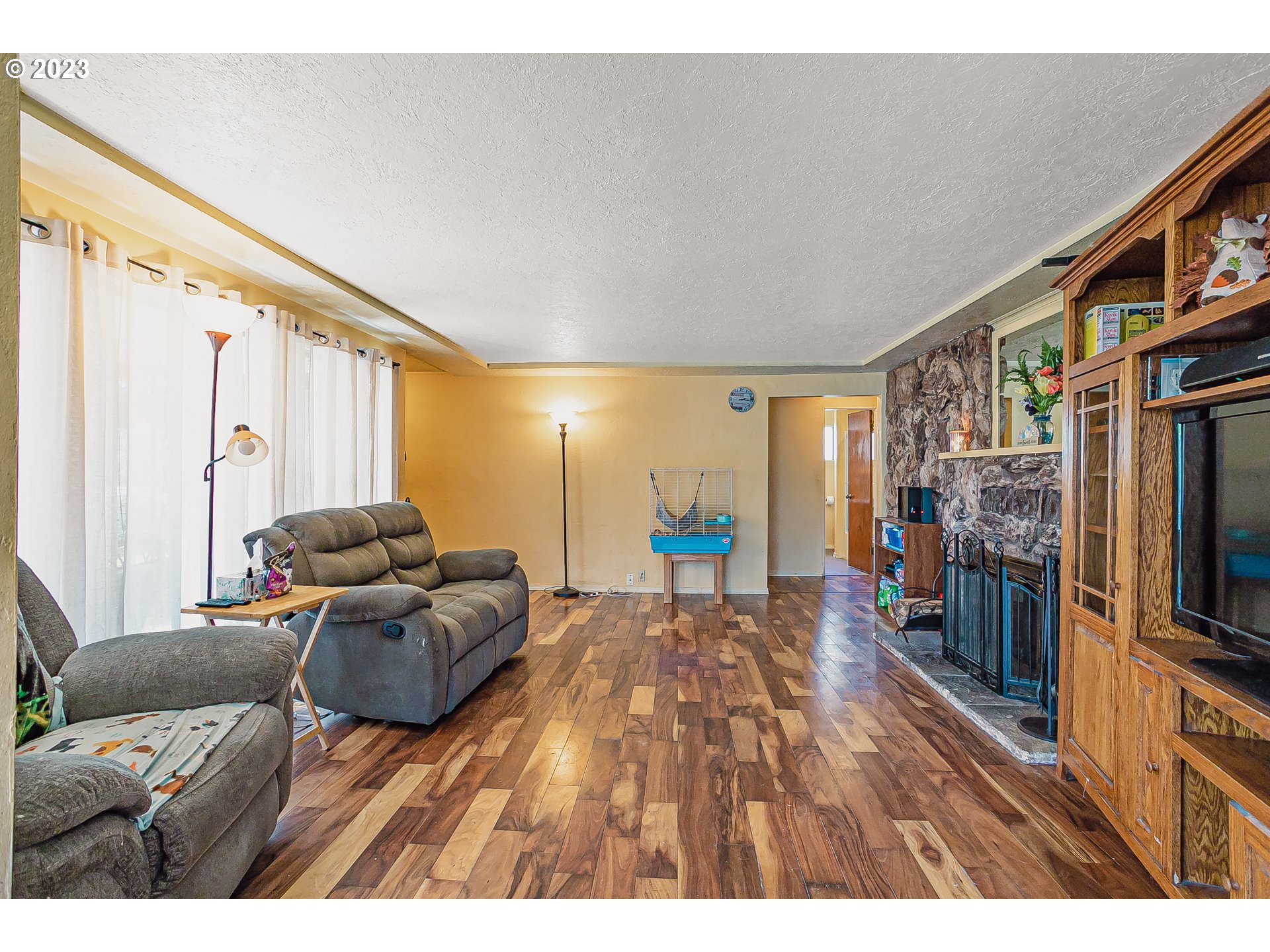 465 North 24th Street Springfield, OR 97477 - Photo 7 of 30 a living room with furniture and a flat screen tv