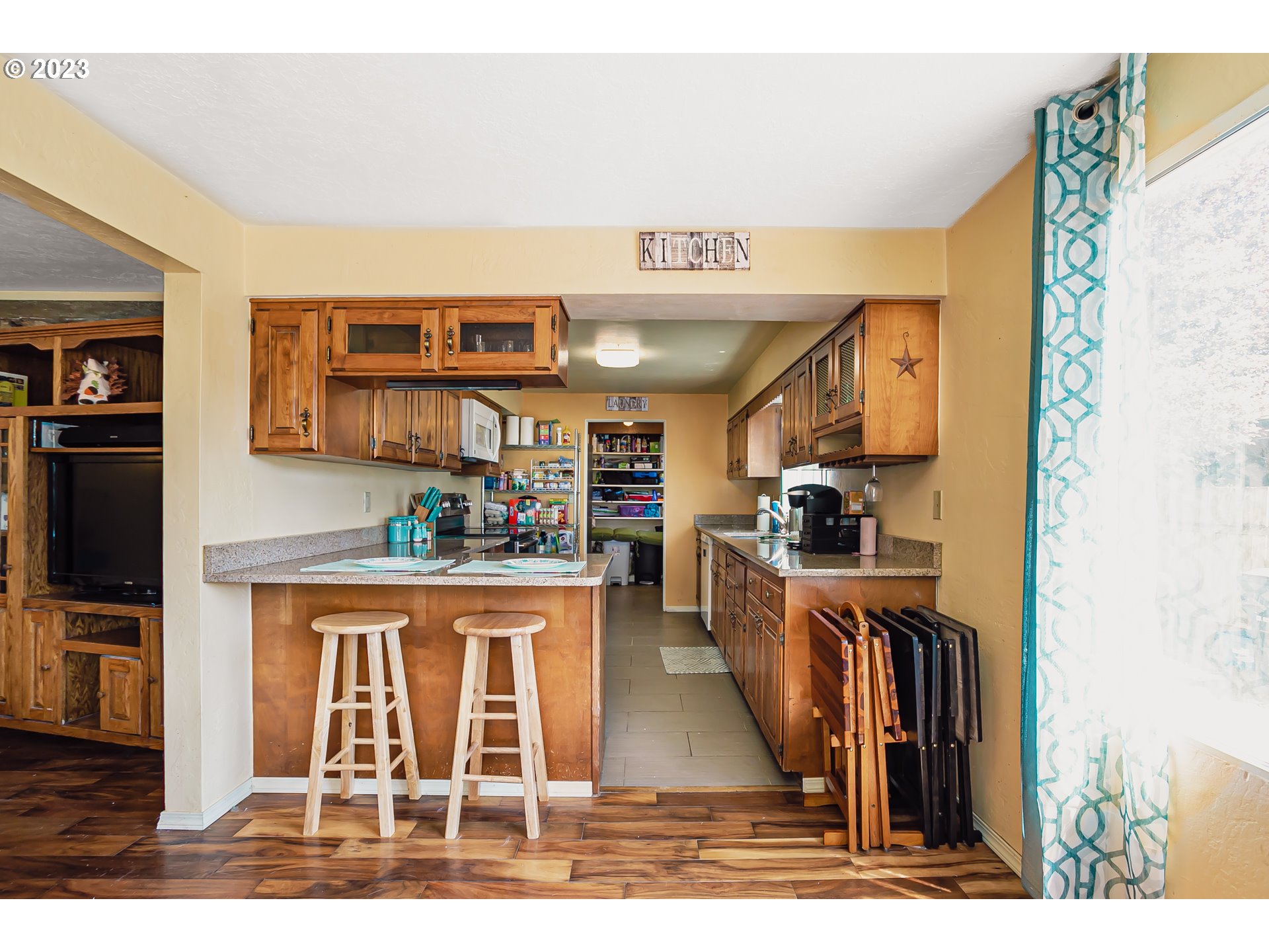 465 North 24th Street Springfield, OR 97477 - Photo 10 of 30 a living room with stainless steel appliances kitchen island granite countertop a living room view