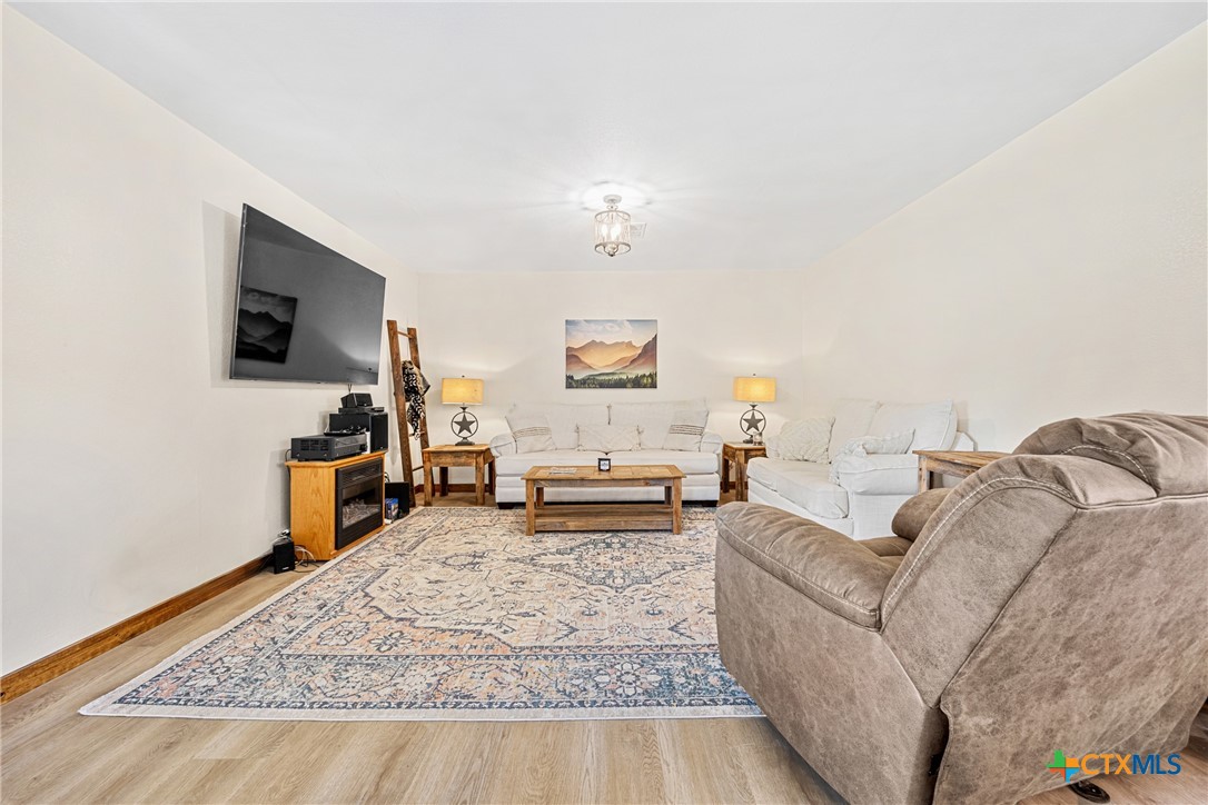 370 County Road 3106 Kempner, TX 76539 - Photo 11 of 34 a living room with furniture and a flat screen tv