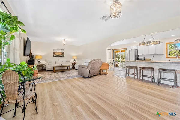 a living room with furniture and a table