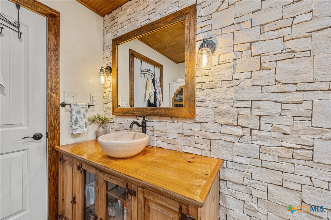 370 County Road 3106 Kempner, TX 76539 - Photo 22 of 34 a bathroom with a sink and a mirror