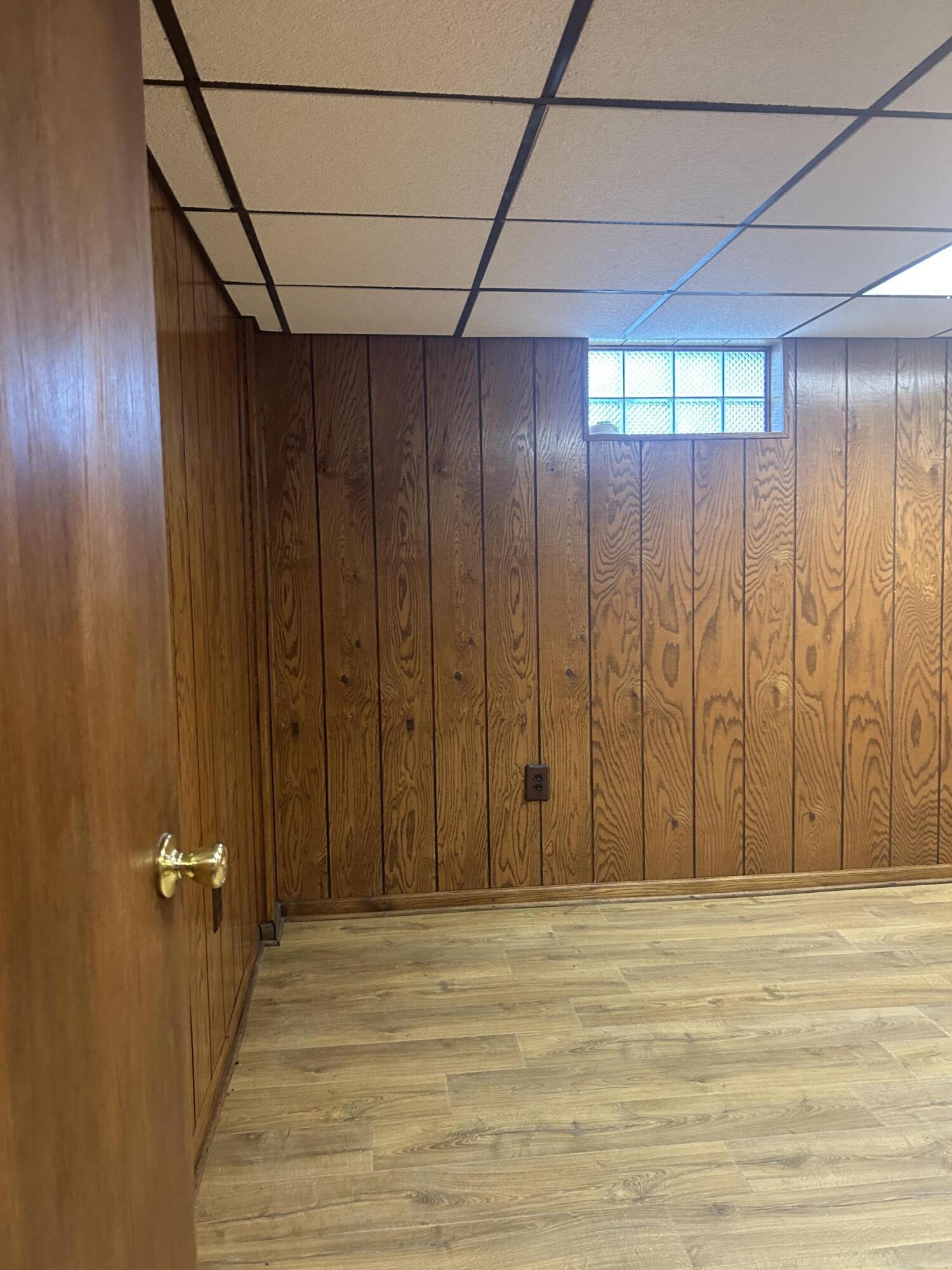 3679 Monroe Street Gary, IN 46408 - Photo 16 of 23 a view of a room with wooden walls