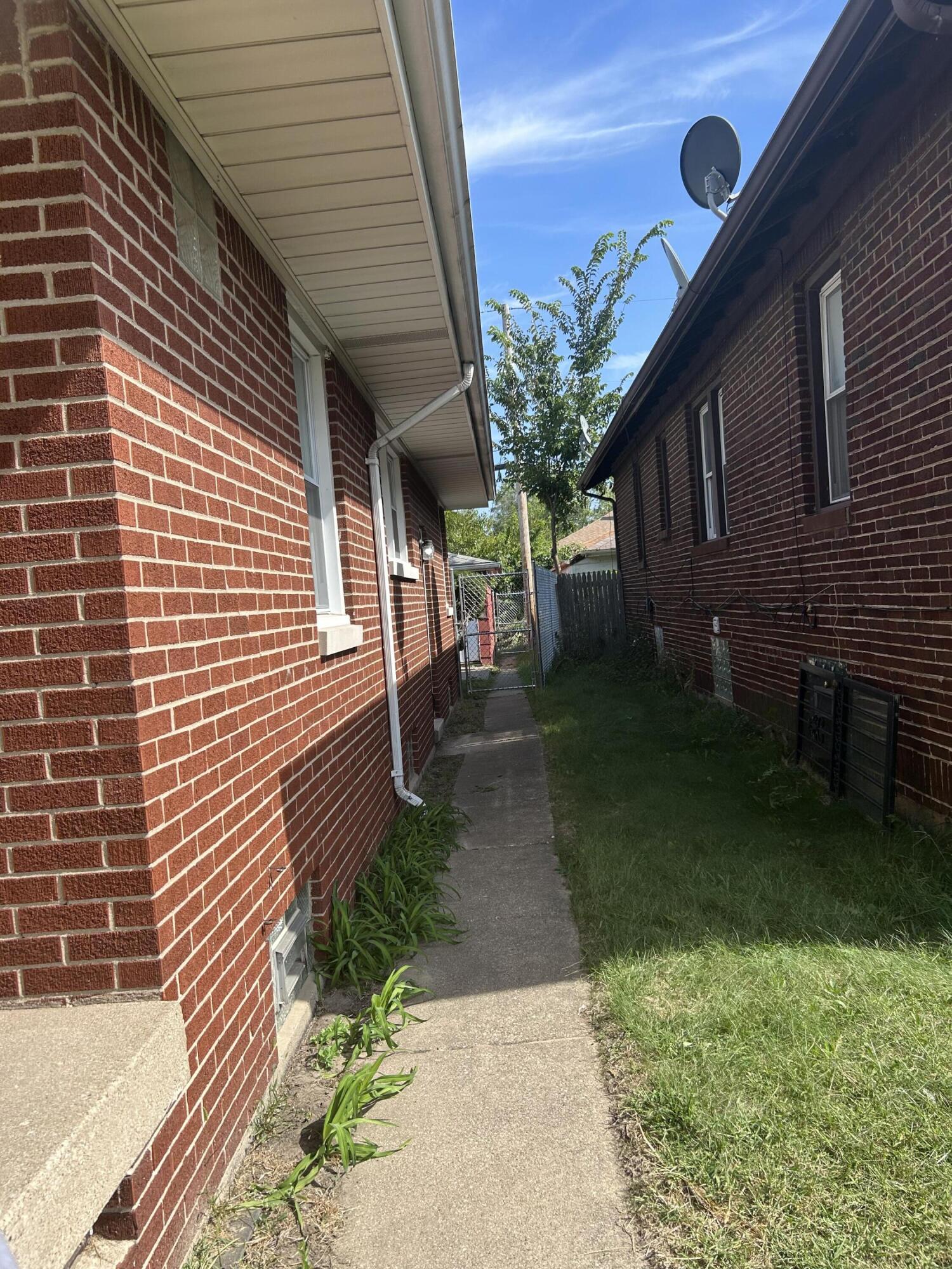 3679 Monroe Street Gary, IN 46408 - Photo 21 of 23 a backyard of a house with lots of green space