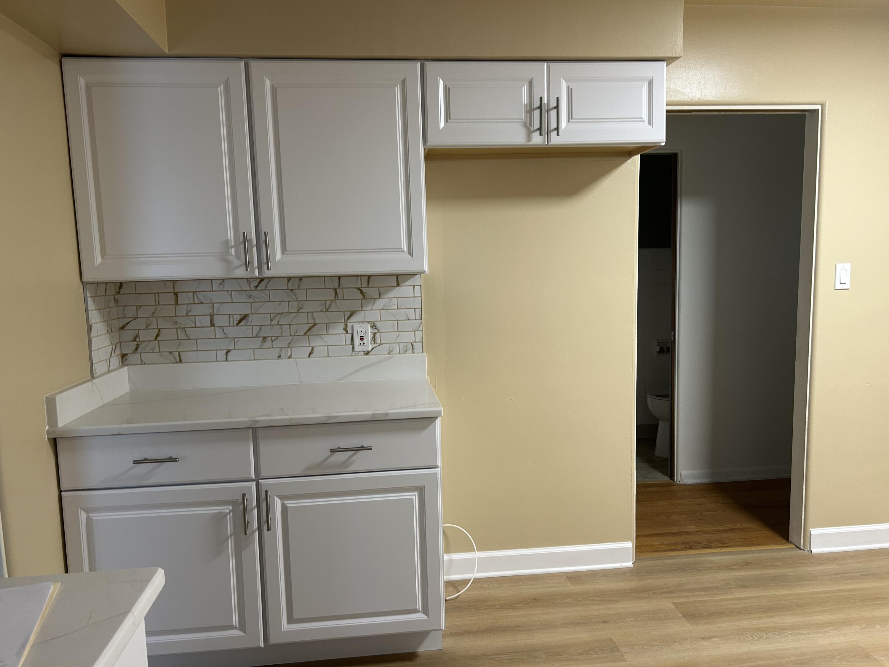 3679 Monroe Street Gary, IN 46408 - Photo 7 of 23 a bathroom with a sink and a mirror