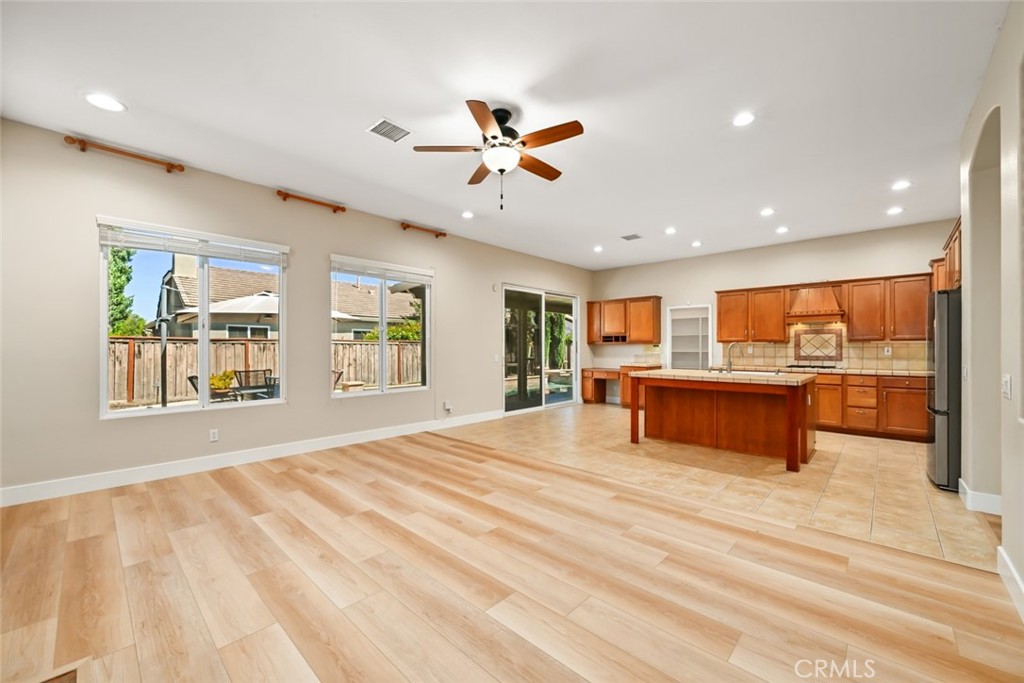 26764 Kingwood Road Murrieta, CA 92563 - Photo 14 of 42 a view of an empty room with window and cabinet