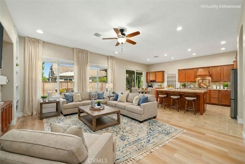 26764 Kingwood Road Murrieta, CA 92563 - Photo 15 of 42 a living room with furniture kitchen view and a large window