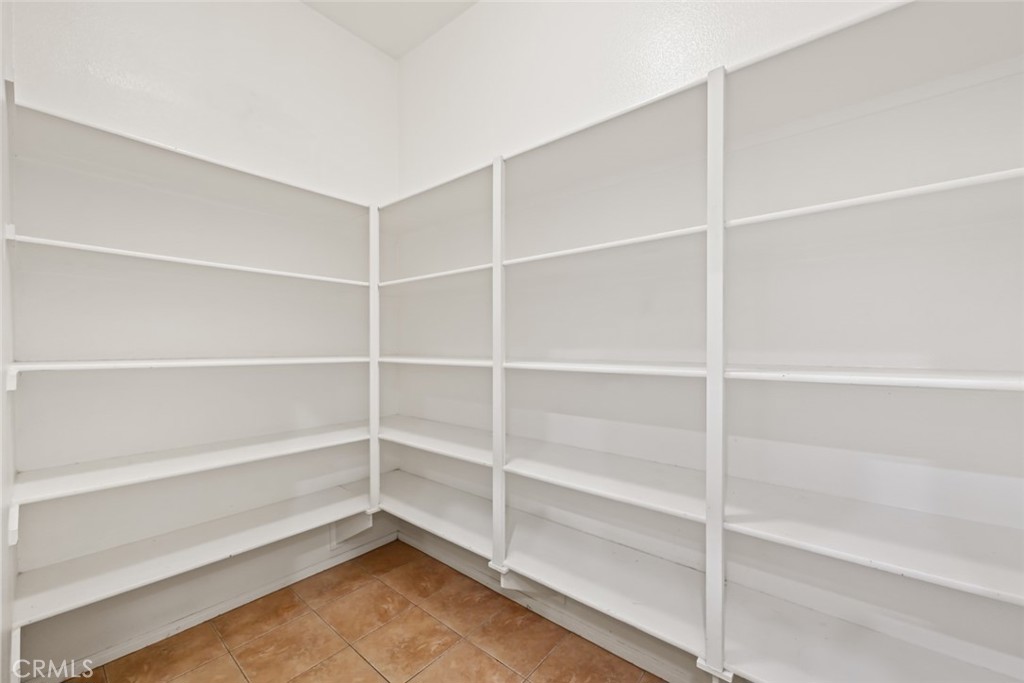 26764 Kingwood Road Murrieta, CA 92563 - Photo 22 of 42 a view of an empty room with empty racks