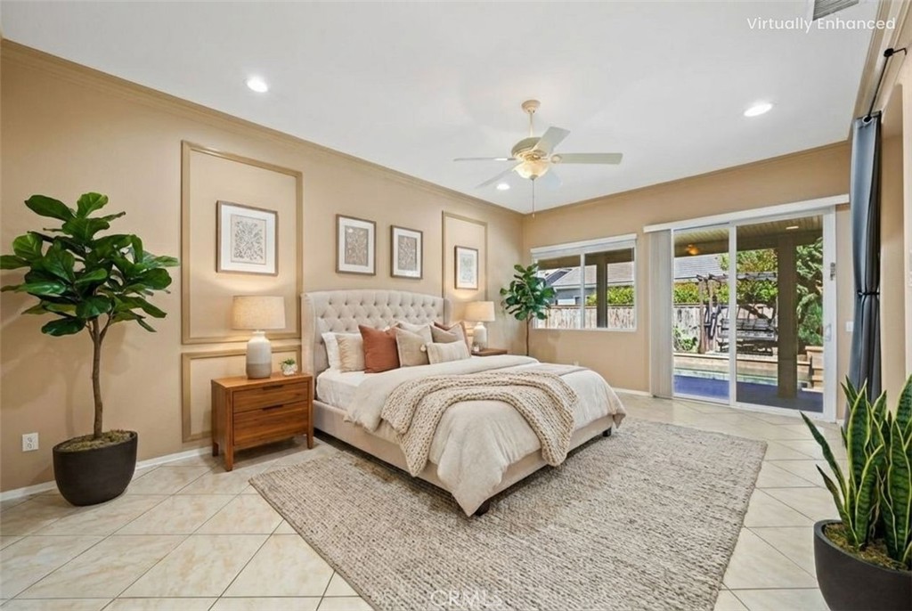 26764 Kingwood Road Murrieta, CA 92563 - Photo 24 of 42 a bedroom with a large bed and a potted plant