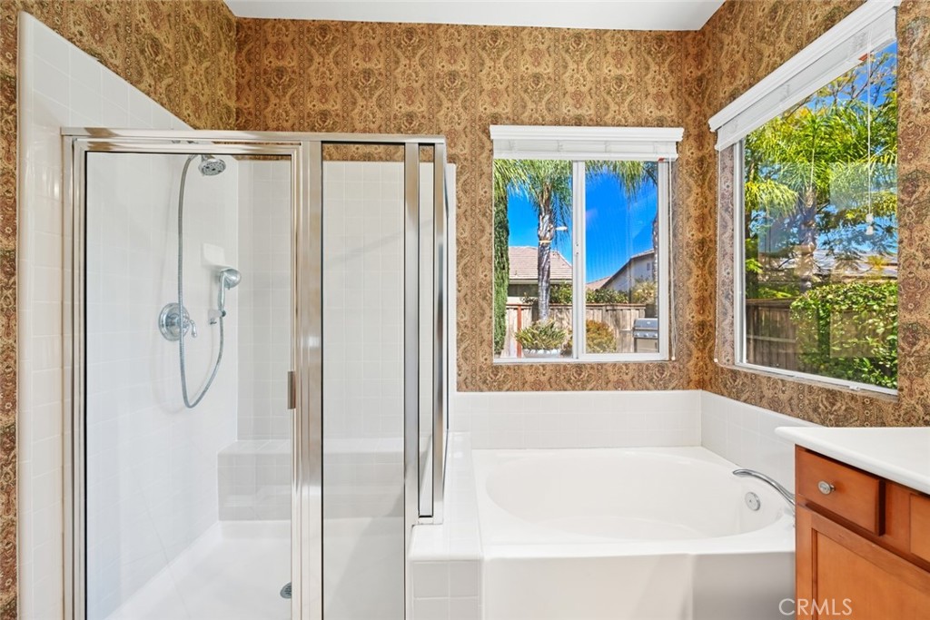 26764 Kingwood Road Murrieta, CA 92563 - Photo 26 of 42 a bathroom with a bath tub and a shower