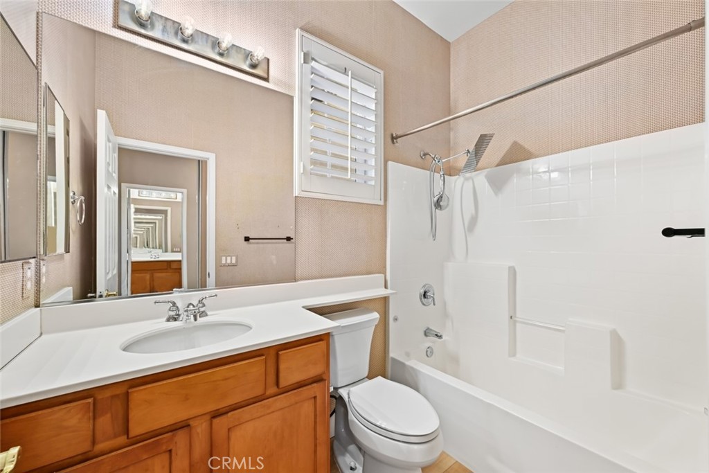 26764 Kingwood Road Murrieta, CA 92563 - Photo 30 of 42 a bathroom with a sink a toilet and shower