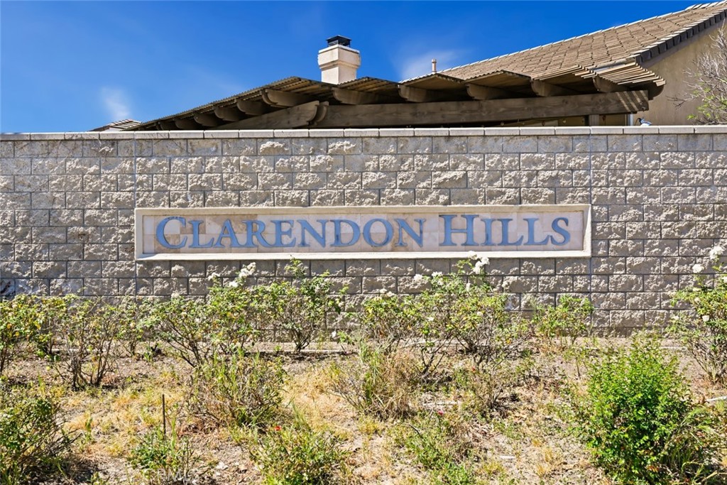 26764 Kingwood Road Murrieta, CA 92563 - Photo 4 of 42 a sign that is on the side of a building