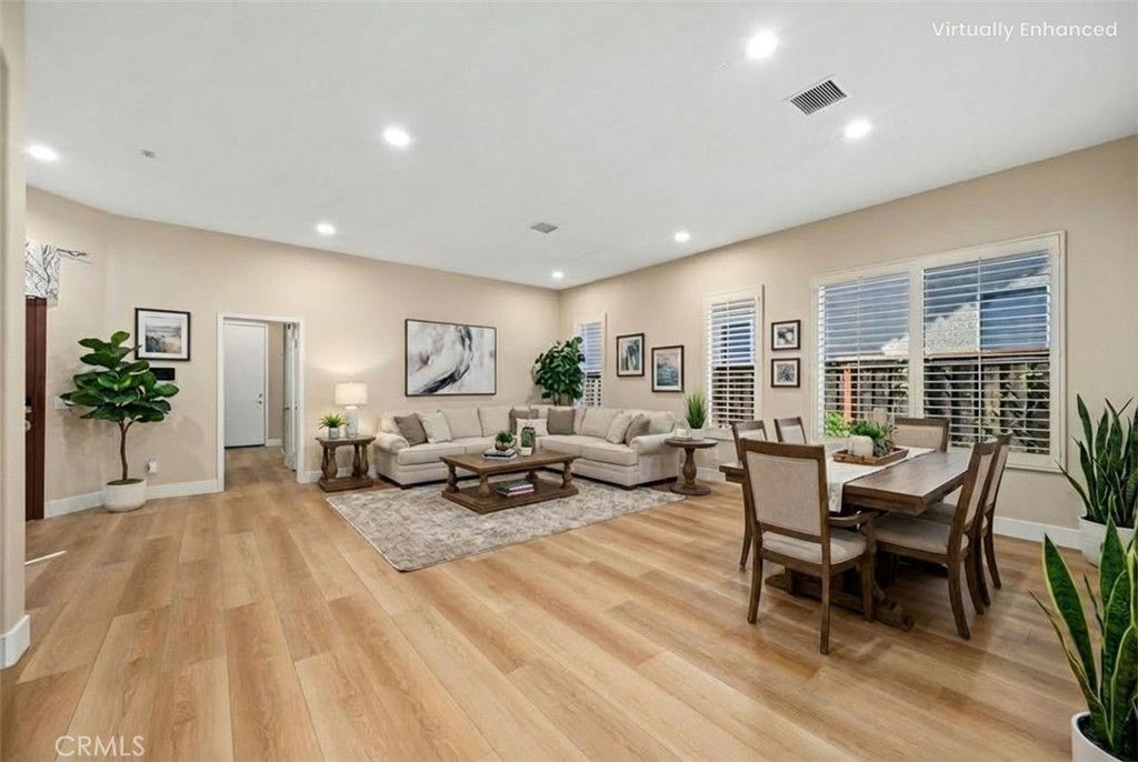 26764 Kingwood Road Murrieta, CA 92563 - Photo 7 of 42 a living room with furniture and wooden floor