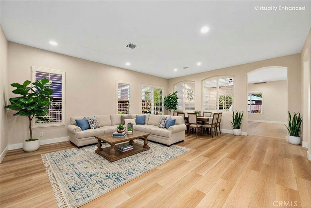 26764 Kingwood Road Murrieta, CA 92563 - Photo 9 of 42 a living room with furniture and a potted plant