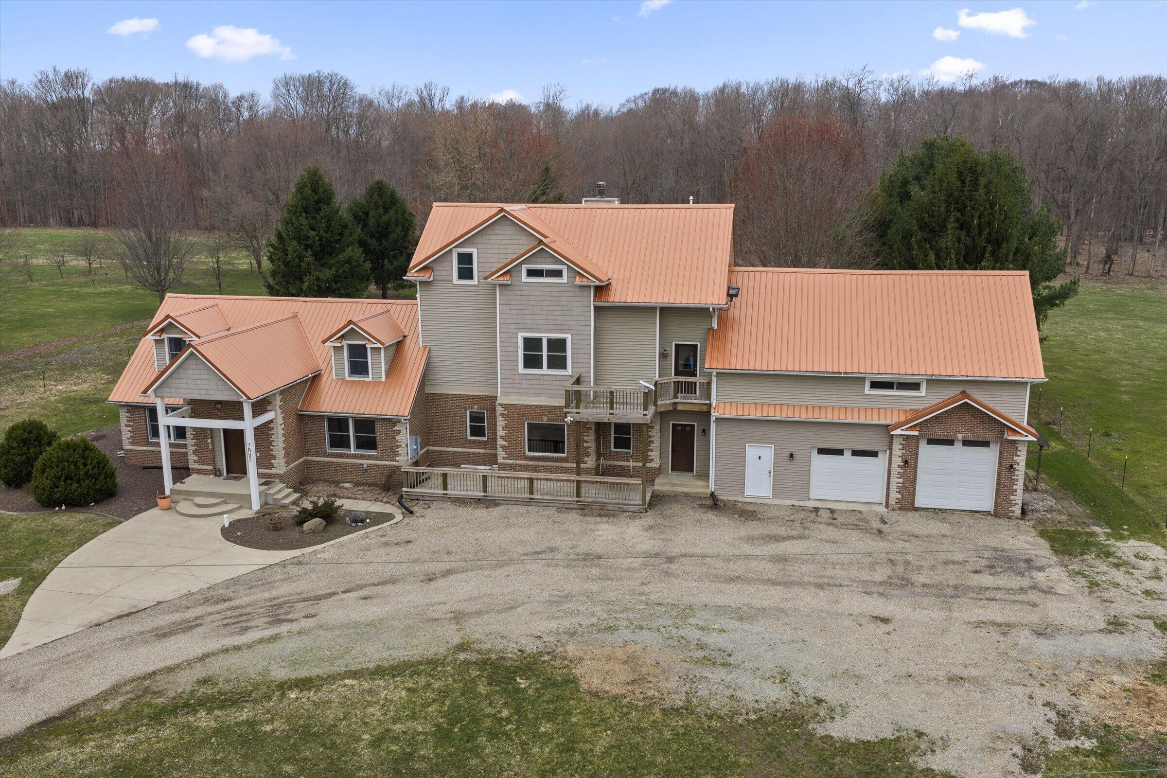 7692 North Emery Road Rolling Prairie, IN 46371 - Photo 57 of 69 an aerial view of a house with garden