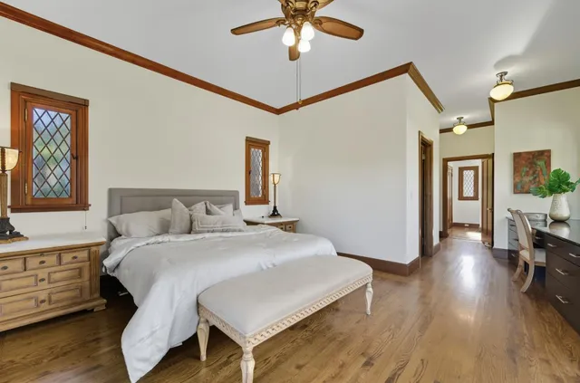 a bathroom with double vanity sinks a vanity and a large mirror