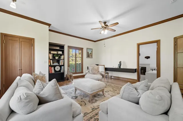 a spacious bathroom with a tub sink and mirror