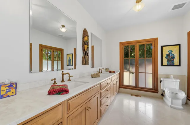 a view of a patio with table and chairs potted plants with wooden fence