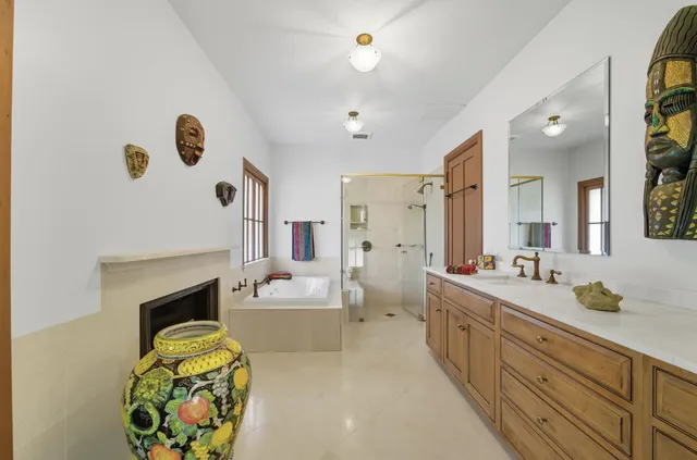a view of a patio with table and chairs under an umbrella