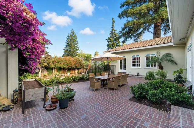 a view of a swimming pool and trees in the background