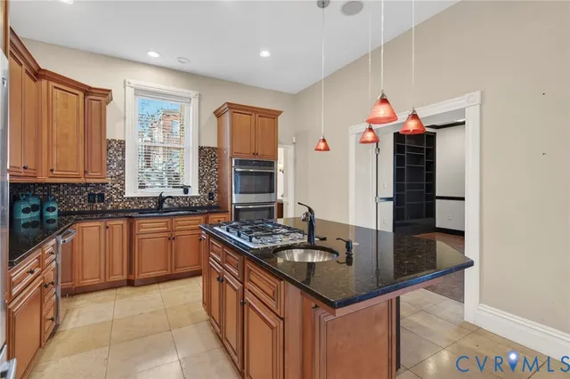 a kitchen that has a lot of cabinets in it