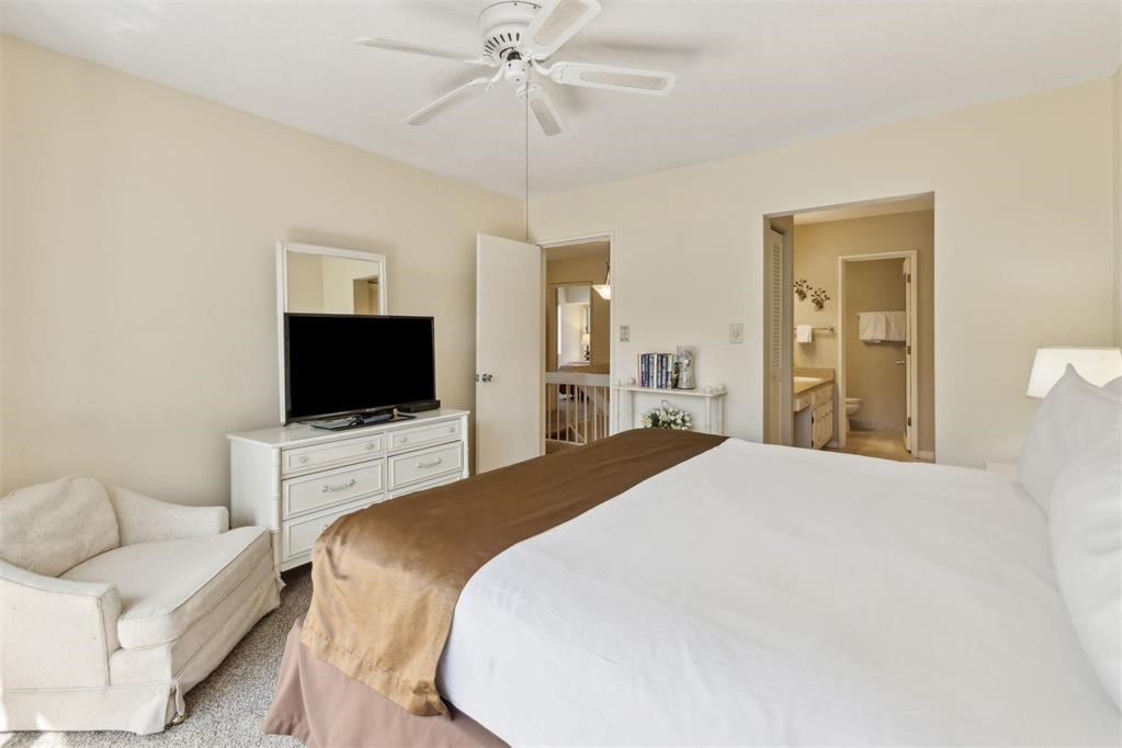 2004 Beachwood Road, Unit 2004 Fernandina Beach, FL 32034 - Photo 26 of 54 a bedroom with a bed and a flat screen tv