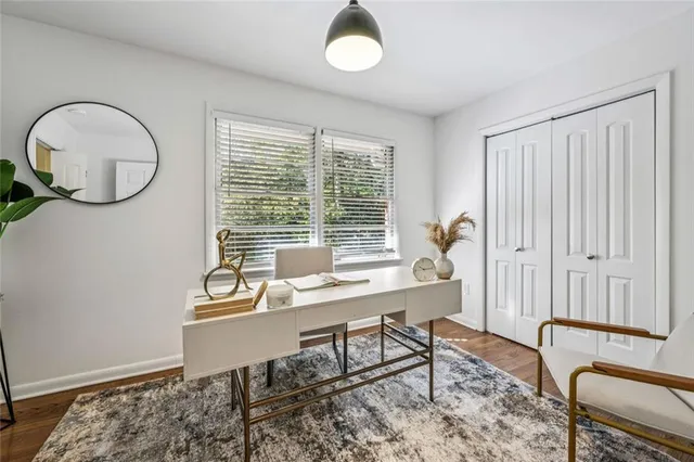 a workspace with furniture and a window