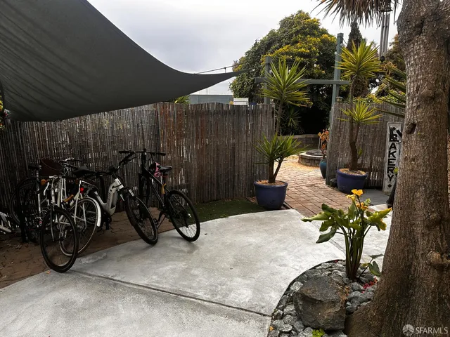 a view of a backyard with potted plants