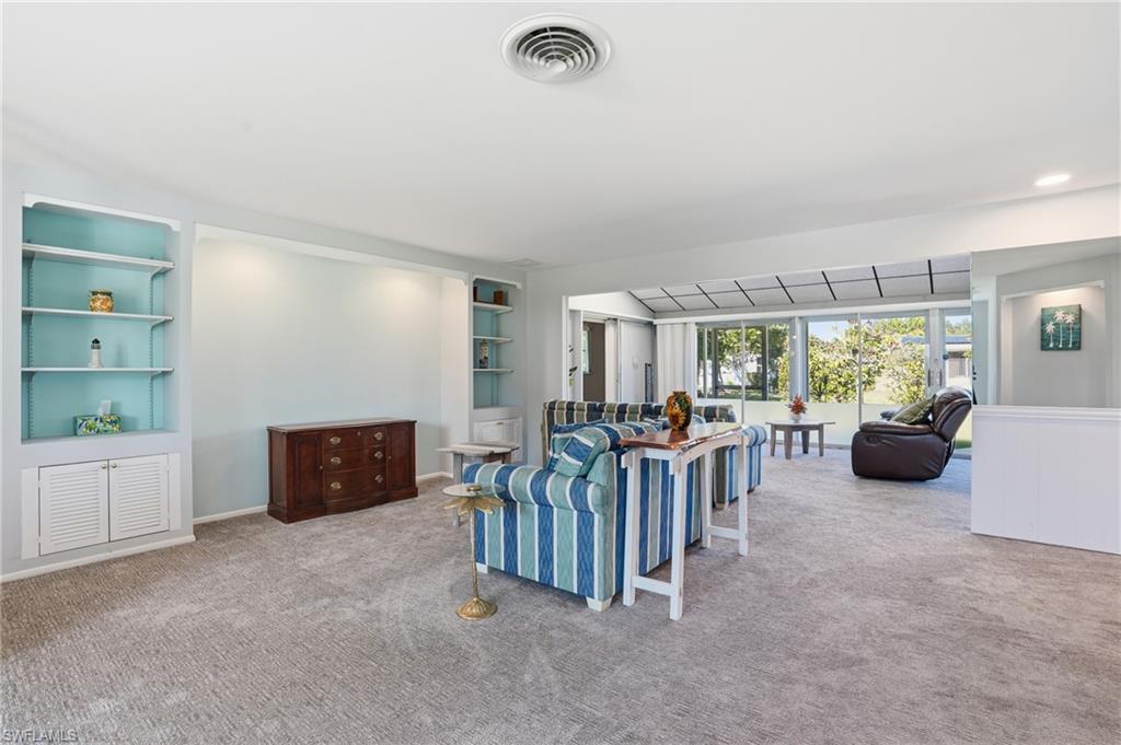 30 Maui Circle, Unit 30 Naples, FL 34112 - Photo 13 of 50 a view of a livingroom with furniture and floor to ceiling window