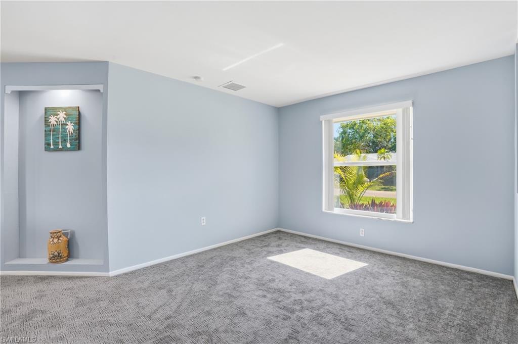 30 Maui Circle, Unit 30 Naples, FL 34112 - Photo 14 of 50 an empty room with windows