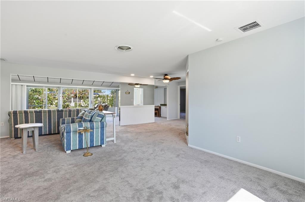 30 Maui Circle, Unit 30 Naples, FL 34112 - Photo 15 of 50 a view of a livingroom with furniture and floor to ceiling window