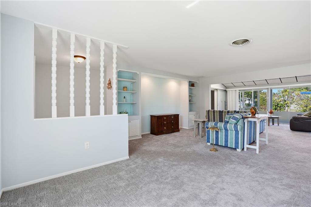 30 Maui Circle, Unit 30 Naples, FL 34112 - Photo 16 of 50 a view of a livingroom with furniture and white walls