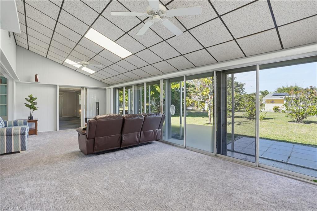 30 Maui Circle, Unit 30 Naples, FL 34112 - Photo 25 of 50 a living room with furniture and a large window