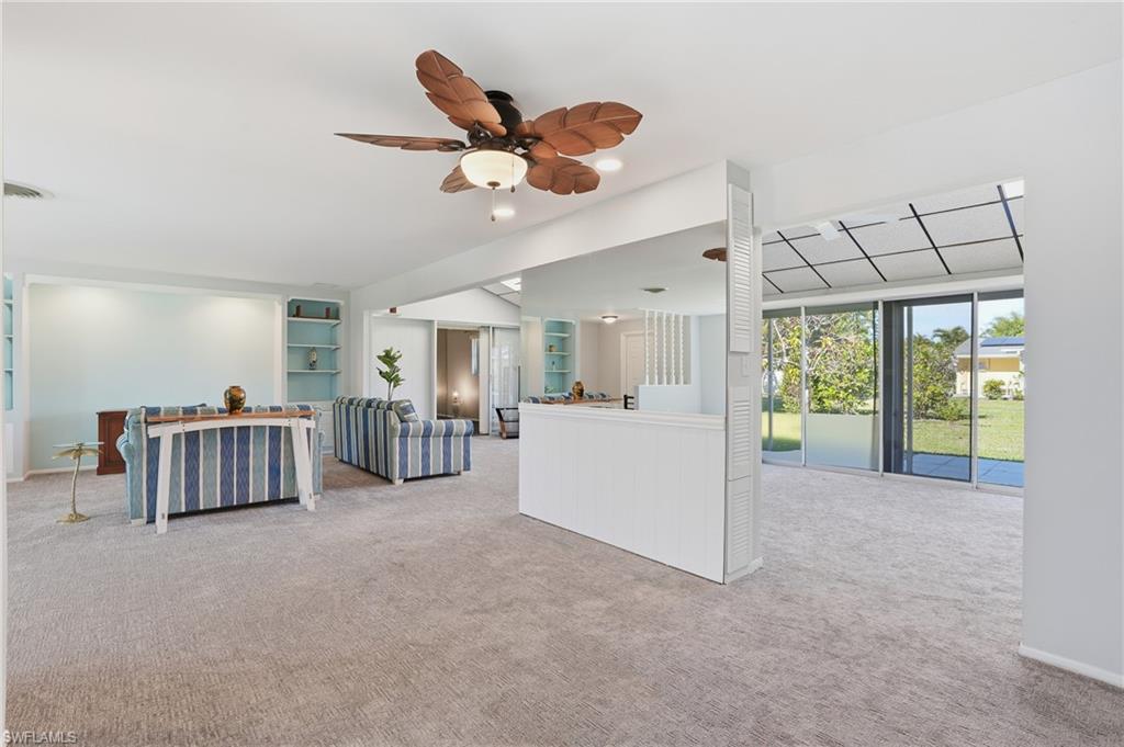 30 Maui Circle, Unit 30 Naples, FL 34112 - Photo 50 of 50 a living room with furniture and a large window