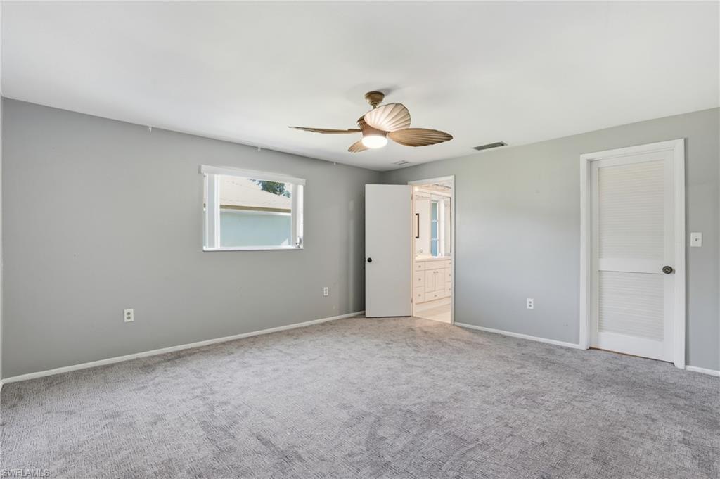 30 Maui Circle, Unit 30 Naples, FL 34112 - Photo 30 of 50 a view of an empty room with a window