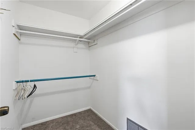 a bathroom with a toilet a sink and shower