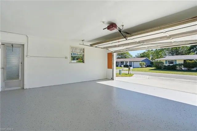 a view of a livingroom with an empty space and a porch