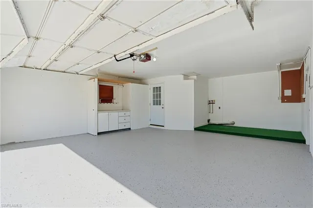 a view of a room with wooden floor and windows