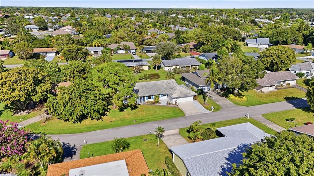 30 Maui Circle, Unit 30 Naples, FL 34112 - Photo 48 of 50 an aerial view of residential houses with outdoor space