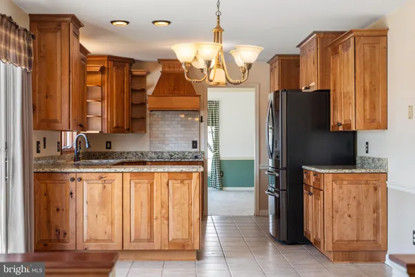 a view of a livingroom with furniture window and fireplace