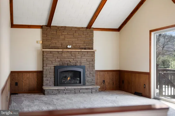 a view of an empty room with a balcony