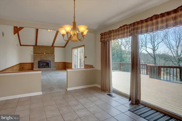 a view of a room with window and chandelier