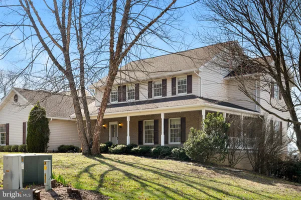 a view of a brick house with a large windows