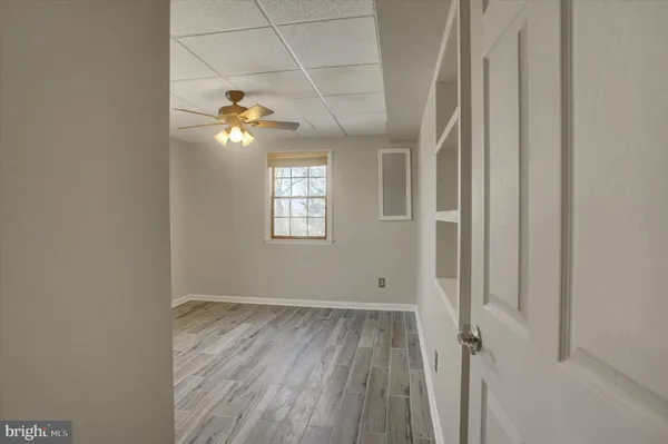 a view of an entryway with a floor to ceiling window
