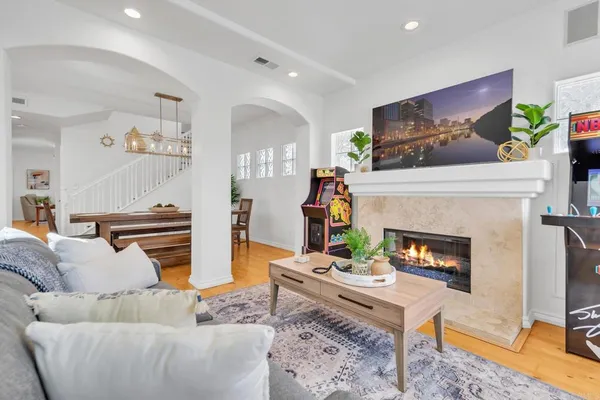a living room with furniture and a fireplace