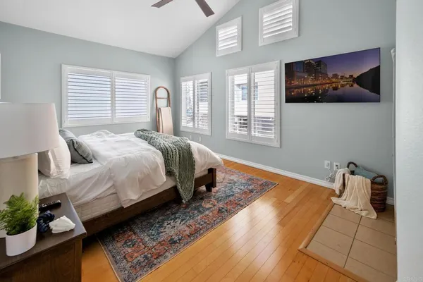 a bedroom with bed and window