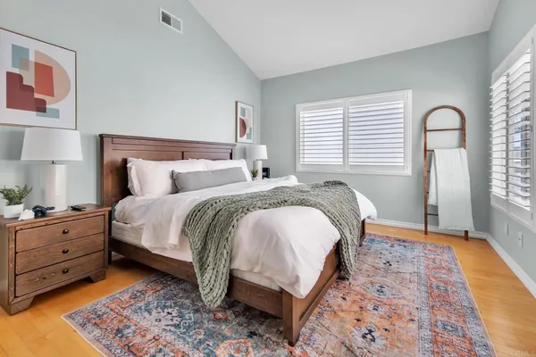 a bed room with a bed and a window