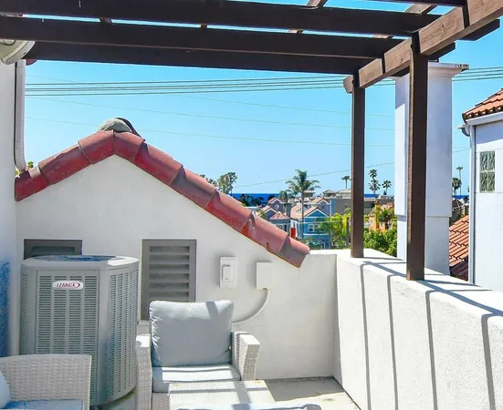 a balcony with furniture and a ceiling fan