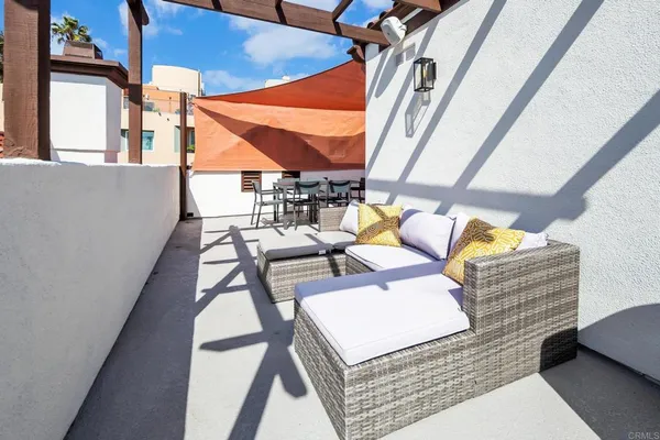 a view of balcony with furniture and rug